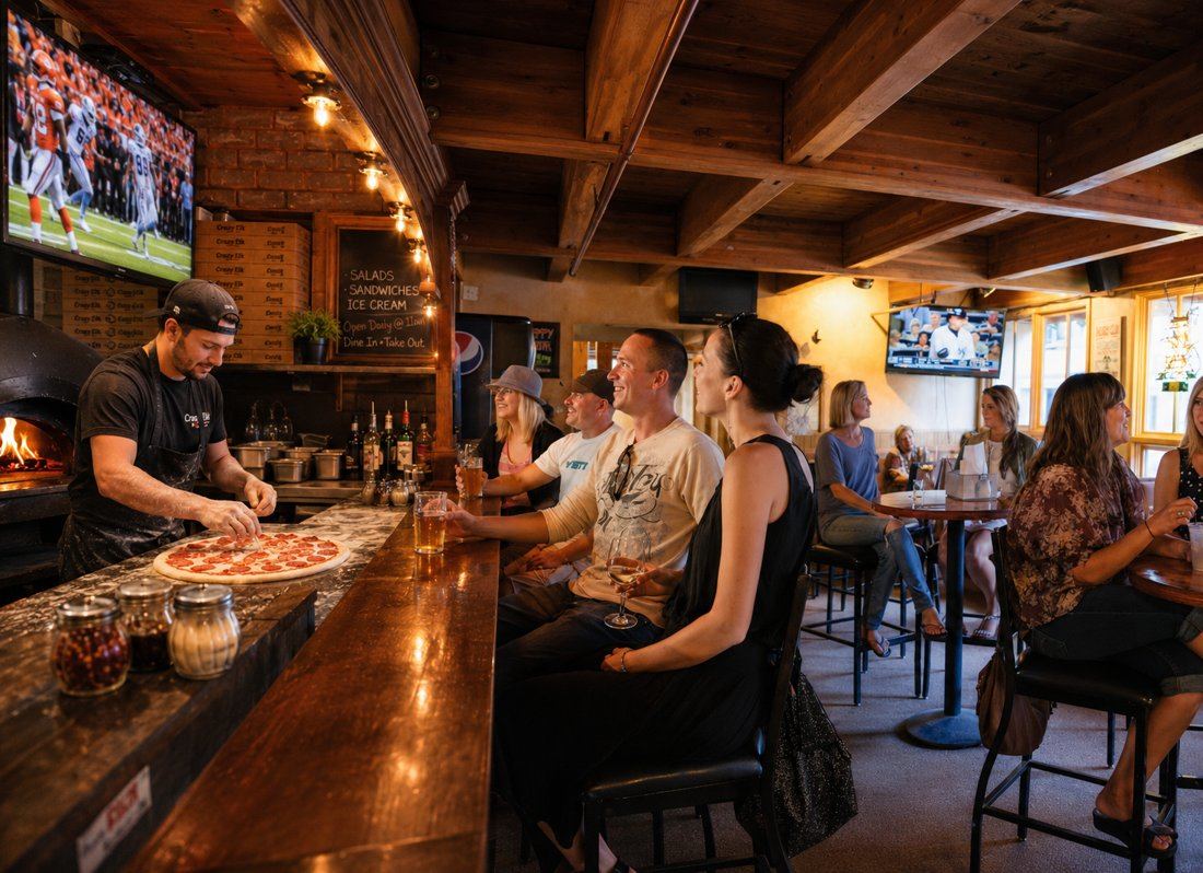 Crowd at the bar watching the game at Crazy Elk
