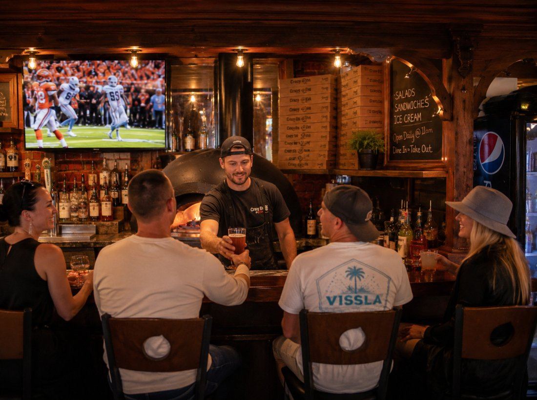 Bartender serving a drink at Crazy Elk
